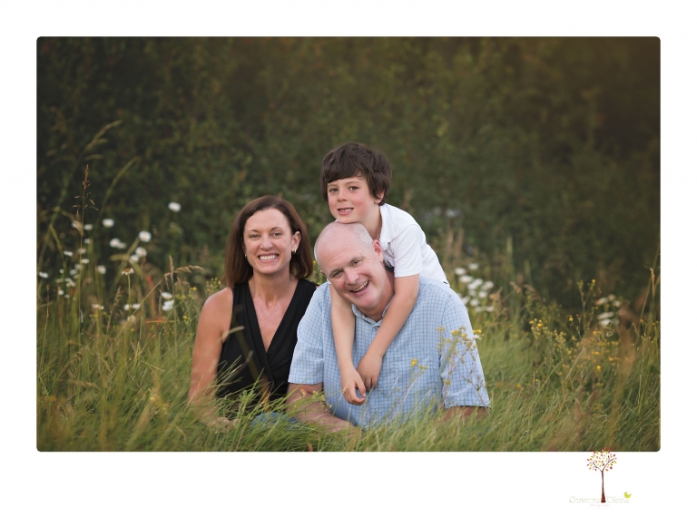 Sonora family photographer Christine Dibble Photography takes sunset family portraits in a field at Lake Tahoe in the summer.