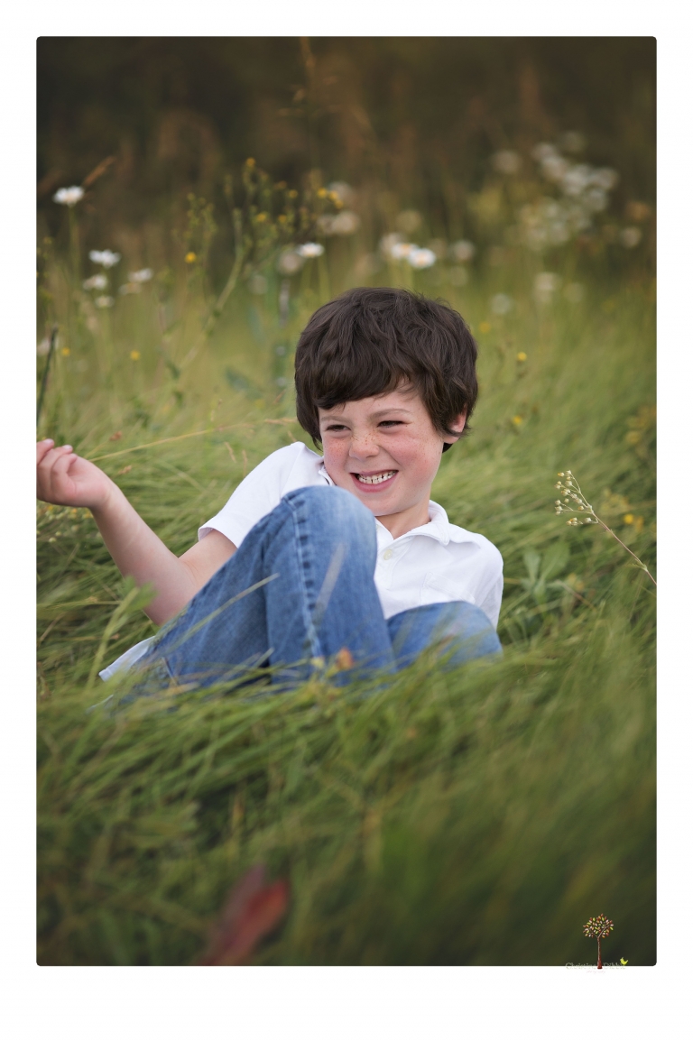 Sonora family photographer Christine Dibble Photography takes sunset family portraits in a field at Lake Tahoe in the summer.
