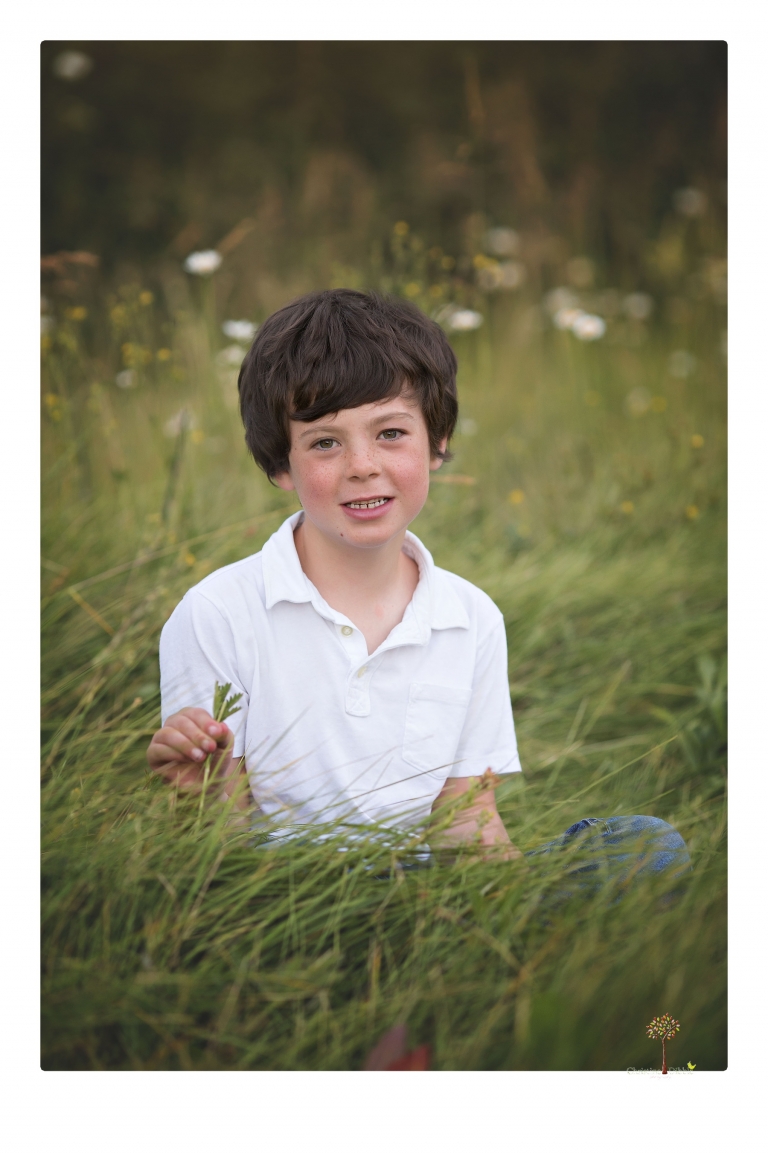 Sonora family photographer Christine Dibble Photography takes sunset family portraits in a field at Lake Tahoe in the summer.