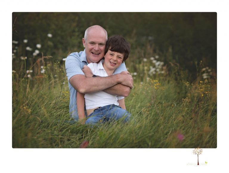 Sonora family photographer Christine Dibble Photography takes sunset family portraits in a field at Lake Tahoe in the summer.