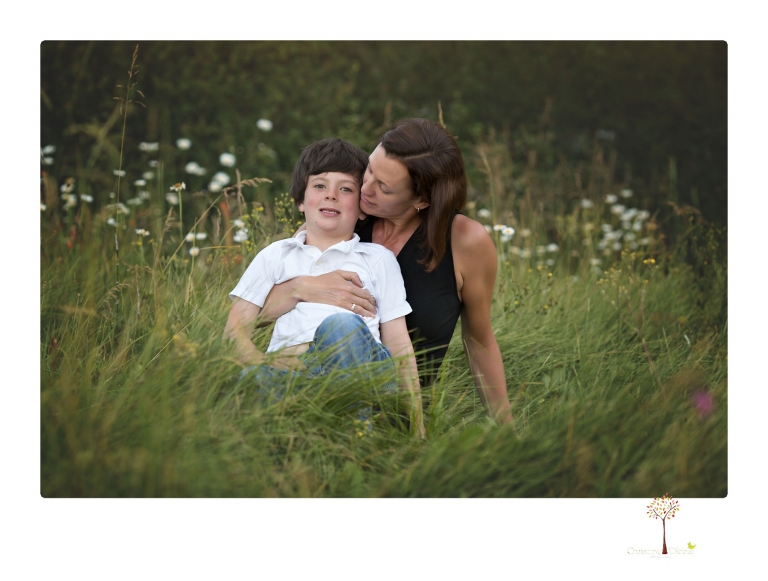 Sonora family photographer Christine Dibble Photography takes sunset family portraits in a field at Lake Tahoe in the summer.