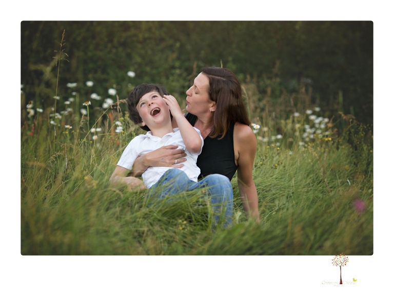 Sonora family photographer Christine Dibble Photography takes sunset family portraits in a field at Lake Tahoe in the summer.