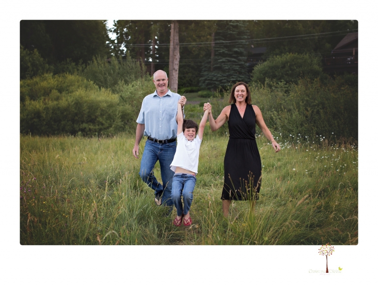Sonora family photographer Christine Dibble Photography takes sunset family portraits in a field at Lake Tahoe in the summer.