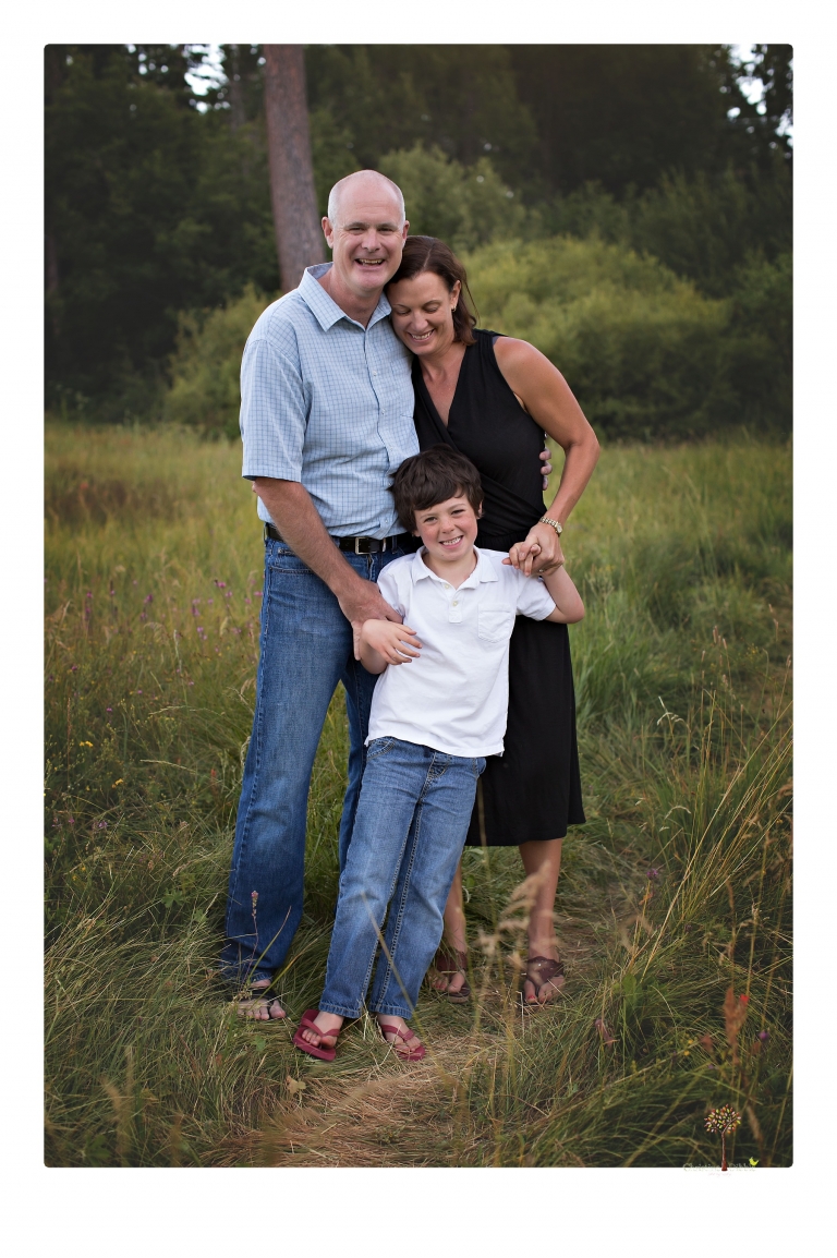 Sonora family photographer Christine Dibble Photography takes sunset family portraits in a field at Lake Tahoe in the summer.