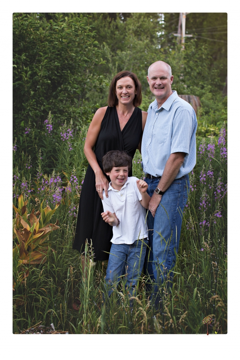Sonora family photographer Christine Dibble Photography takes sunset family portraits in a field at Lake Tahoe in the summer.