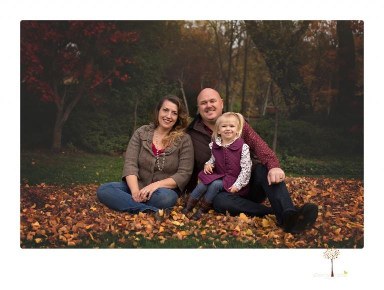 Murphys family photographer Christine Dibble Photography takes family portraits in the fall at Ironstone Vineyards of a family and grandparents as they play in colored leaves.