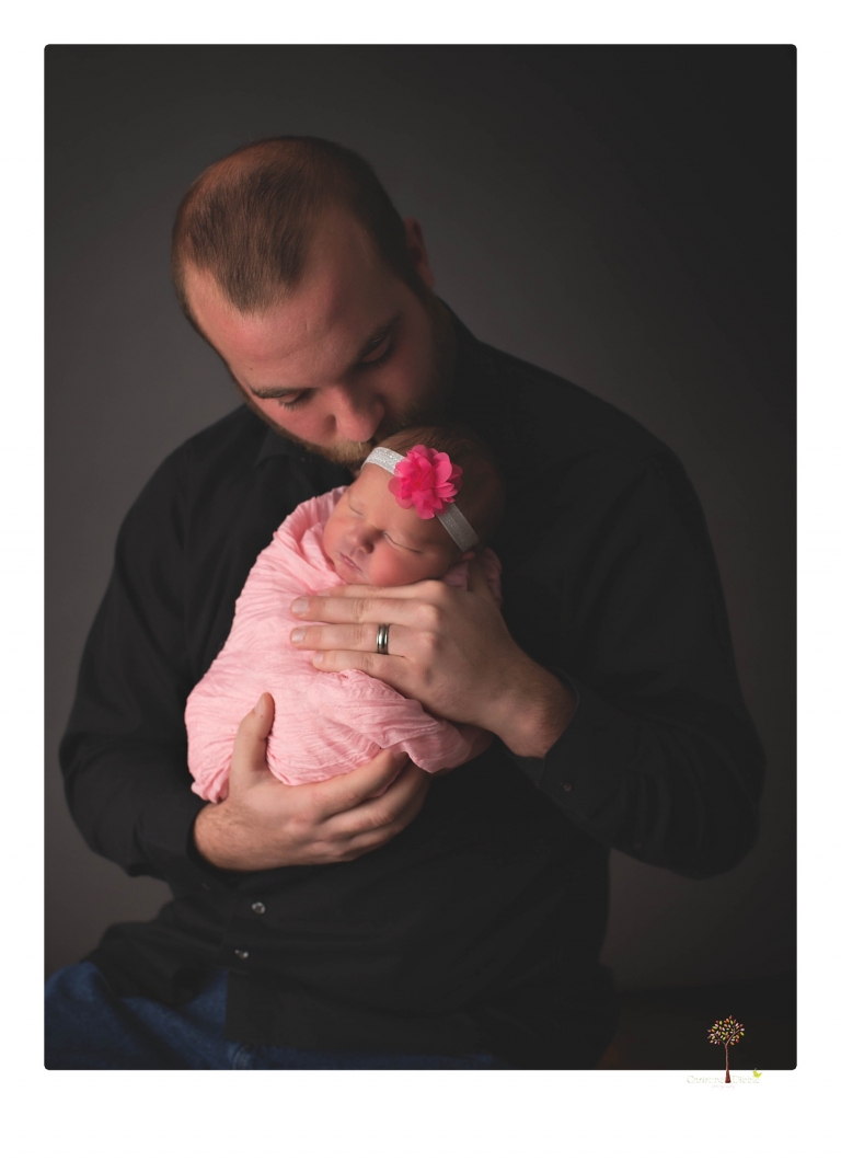 Best Sonora newborn photographer Christine Dibble Photography takes newborn portraits in her studio of a new baby sister and her big brothers and parents.