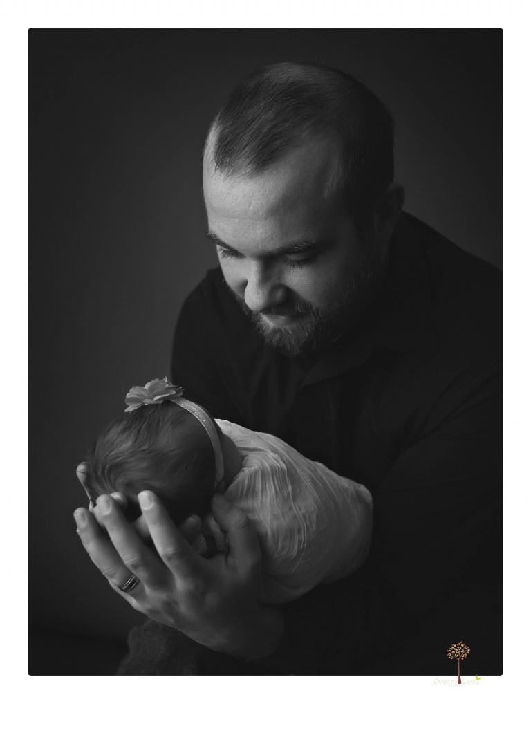 Best Sonora newborn photographer Christine Dibble Photography takes newborn portraits in her studio of a new baby sister and her big brothers and parents.