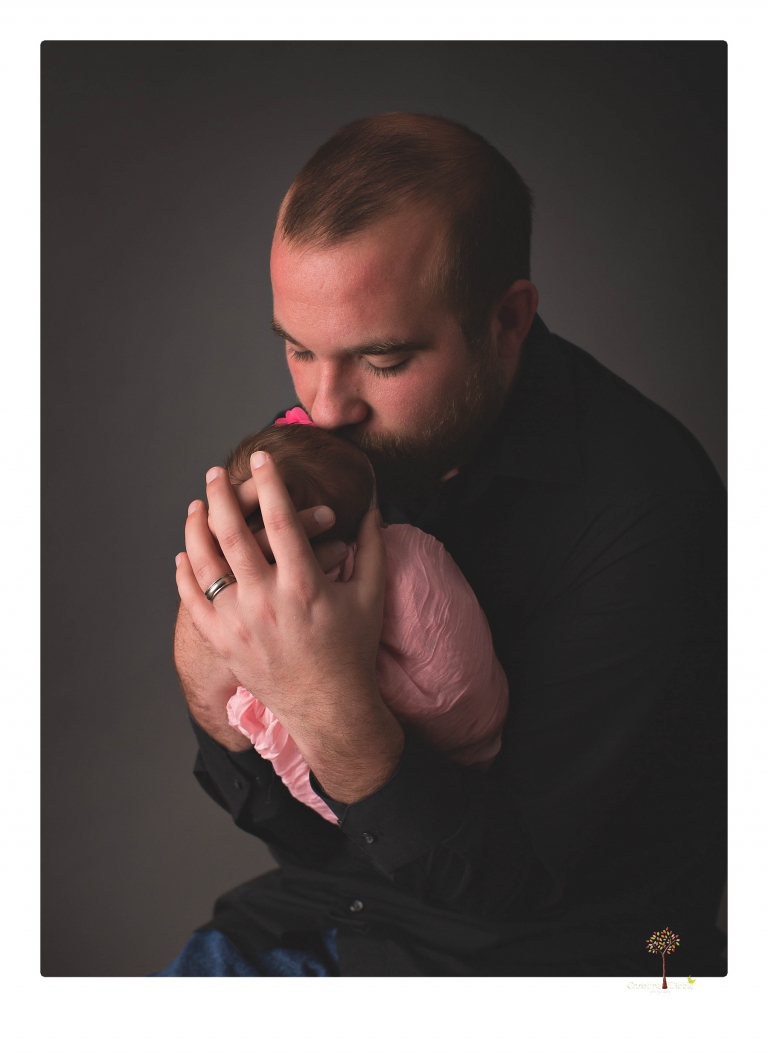 Best Sonora newborn photographer Christine Dibble Photography takes newborn portraits in her studio of a new baby sister and her big brothers and parents.
