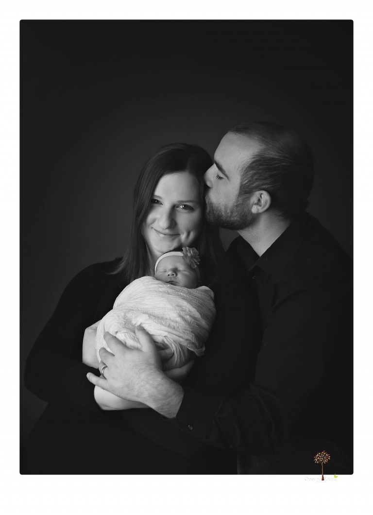 Best Sonora newborn photographer Christine Dibble Photography takes newborn portraits in her studio of a new baby sister and her big brothers and parents.