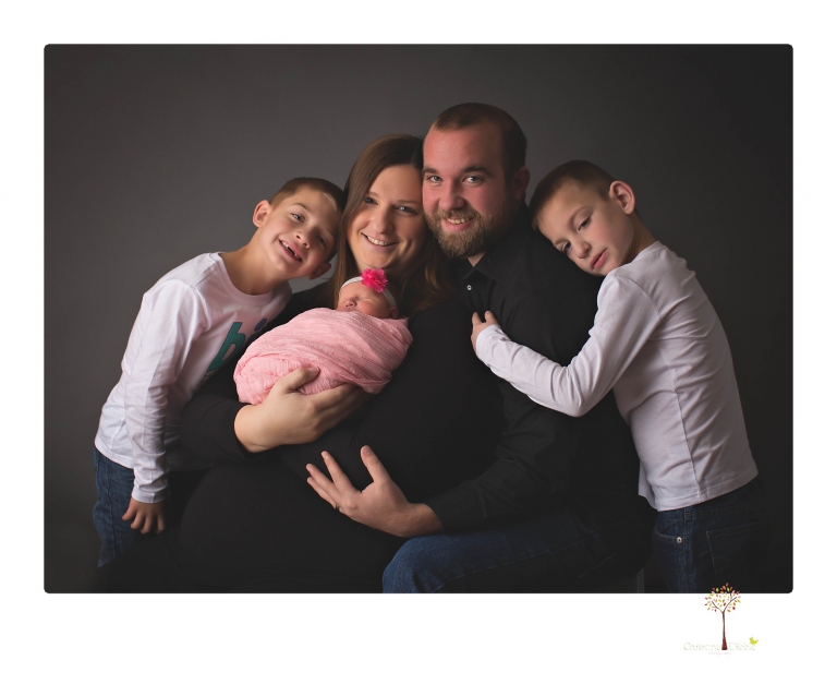 Best Sonora newborn photographer Christine Dibble Photography takes newborn portraits in her studio of a new baby sister and her big brothers and parents.