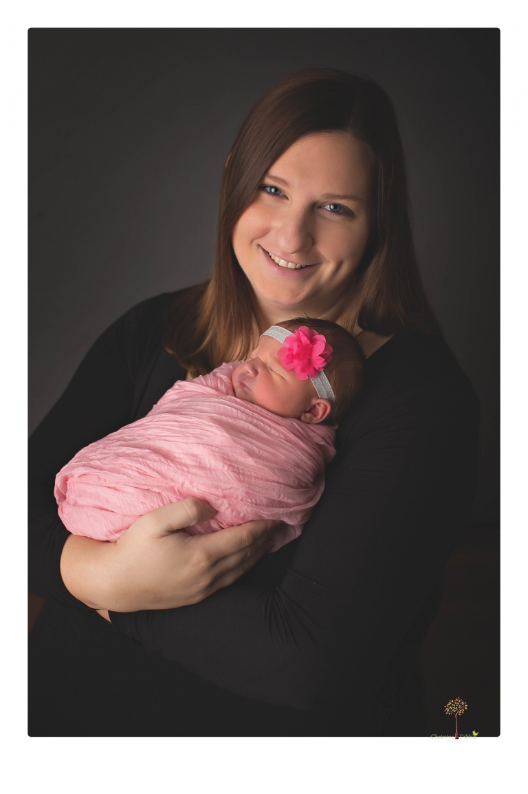 Best Sonora newborn photographer Christine Dibble Photography takes newborn portraits in her studio of a new baby sister and her big brothers and parents.