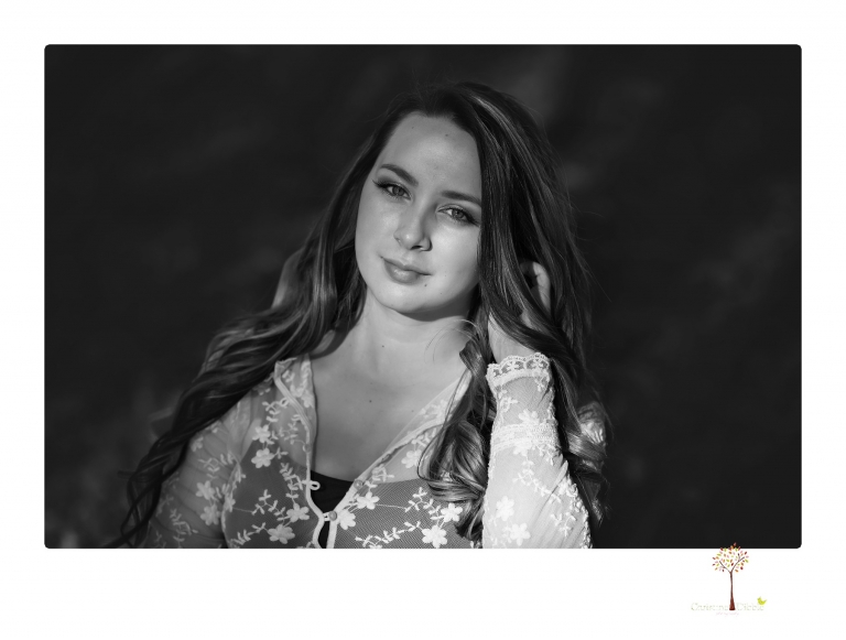 Sonora and Summerville Senior Portrait photographer Christine Dibble Photography takes senior portraits at Indigeny Reserve of a girl with vintage suitcases, a classic Ford Mustang, and her little dog, Pumpkin.