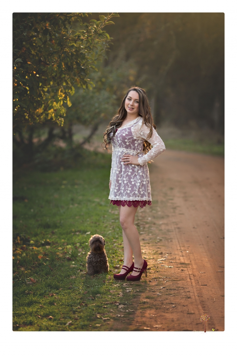 Sonora and Summerville Senior Portrait photographer Christine Dibble Photography takes senior portraits at Indigeny Reserve of a girl with vintage suitcases, a classic Ford Mustang, and her little dog, Pumpkin.