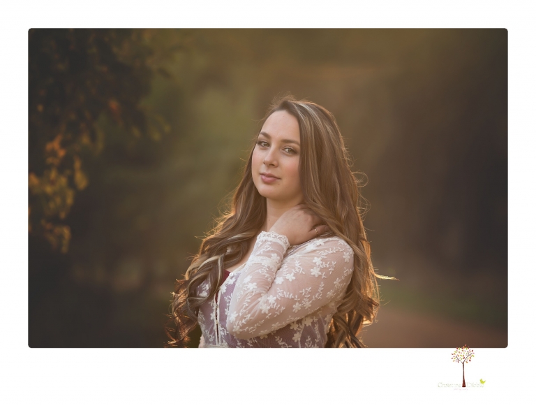 Sonora and Summerville Senior Portrait photographer Christine Dibble Photography takes senior portraits at Indigeny Reserve of a girl with vintage suitcases, a classic Ford Mustang, and her little dog, Pumpkin.