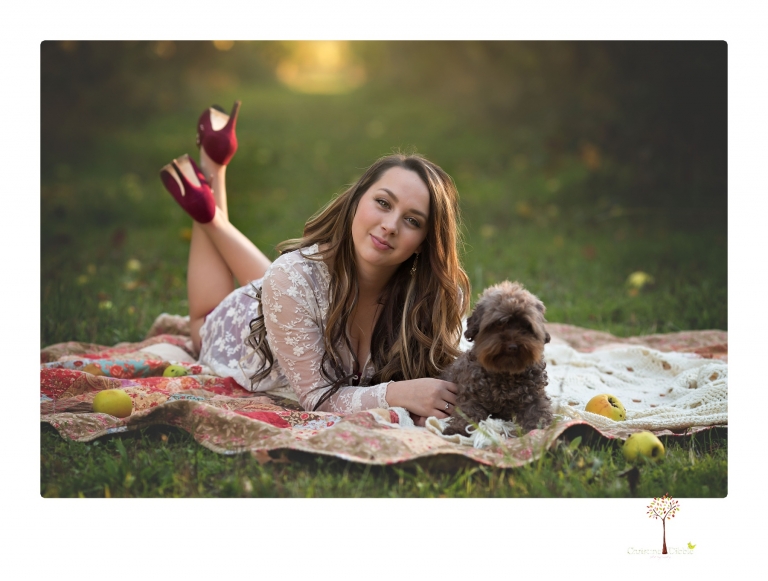 Sonora and Summerville Senior Portrait photographer Christine Dibble Photography takes senior portraits at Indigeny Reserve of a girl with vintage suitcases, a classic Ford Mustang, and her little dog, Pumpkin.