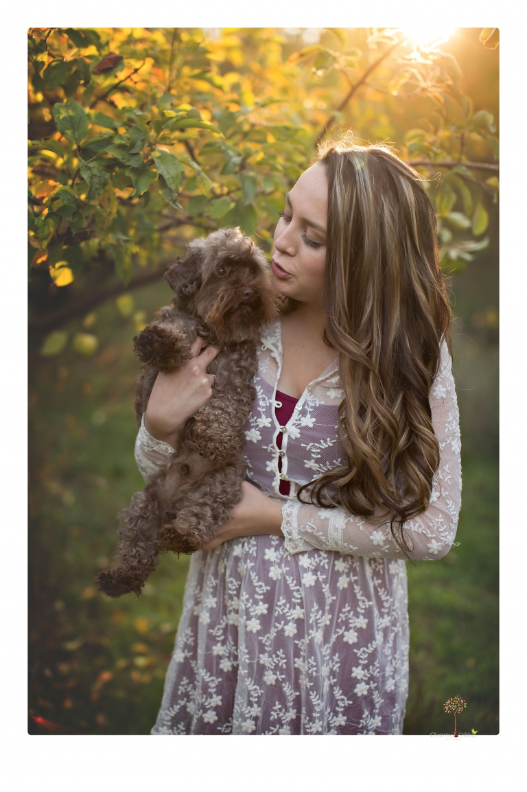 Sonora and Summerville Senior Portrait photographer Christine Dibble Photography takes senior portraits at Indigeny Reserve of a girl with vintage suitcases, a classic Ford Mustang, and her little dog, Pumpkin.