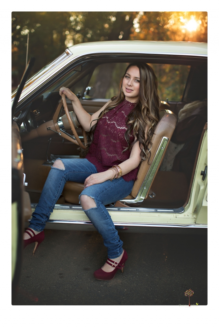 Sonora and Summerville Senior Portrait photographer Christine Dibble Photography takes senior portraits at Indigeny Reserve of a girl with vintage suitcases, a classic Ford Mustang, and her little dog, Pumpkin.