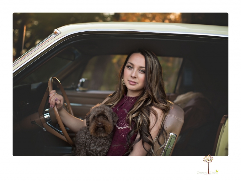 Sonora and Summerville Senior Portrait photographer Christine Dibble Photography takes senior portraits at Indigeny Reserve of a girl with vintage suitcases, a classic Ford Mustang, and her little dog, Pumpkin.