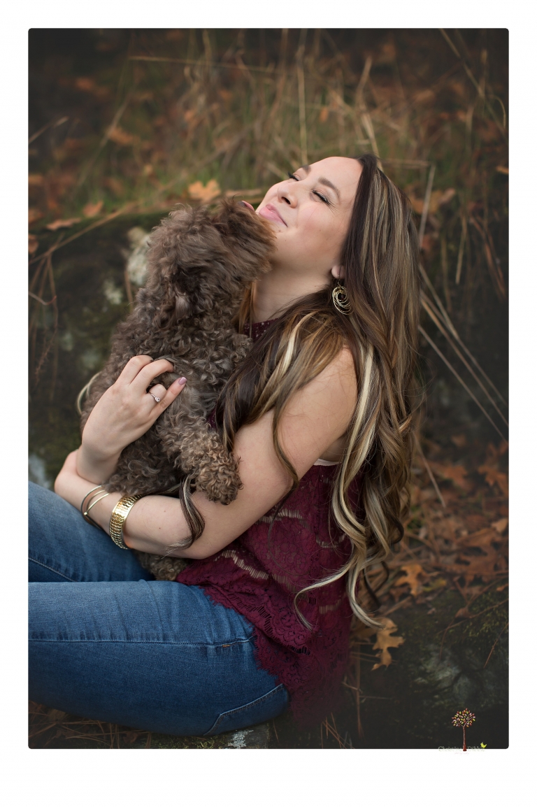 Sonora and Summerville Senior Portrait photographer Christine Dibble Photography takes senior portraits at Indigeny Reserve of a girl with vintage suitcases, a classic Ford Mustang, and her little dog, Pumpkin.