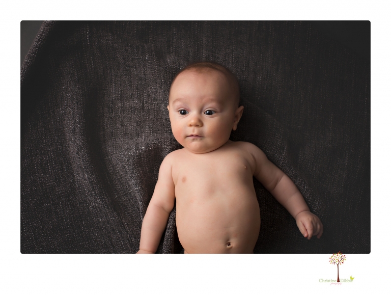 Sonora baby and child photographer Christine Dibble Photography takes three month portraits of a baby boy and his parents in the studio.