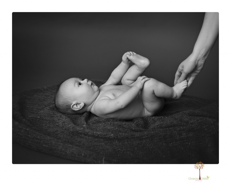Sonora baby and child photographer Christine Dibble Photography takes three month portraits of a baby boy and his parents in the studio.