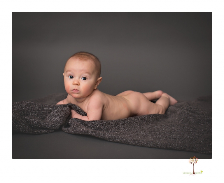 Sonora baby and child photographer Christine Dibble Photography takes three month portraits of a baby boy and his parents in the studio.