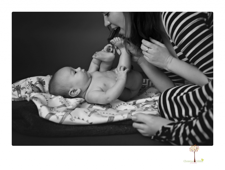 Sonora baby and child photographer Christine Dibble Photography takes three month portraits of a baby boy and his parents in the studio.