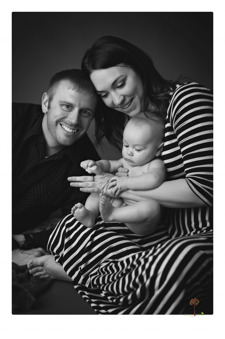 Sonora baby and child photographer Christine Dibble Photography takes three month portraits of a baby boy and his parents in the studio.