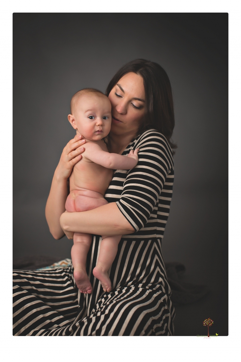 Sonora baby and child photographer Christine Dibble Photography takes three month portraits of a baby boy and his parents in the studio.