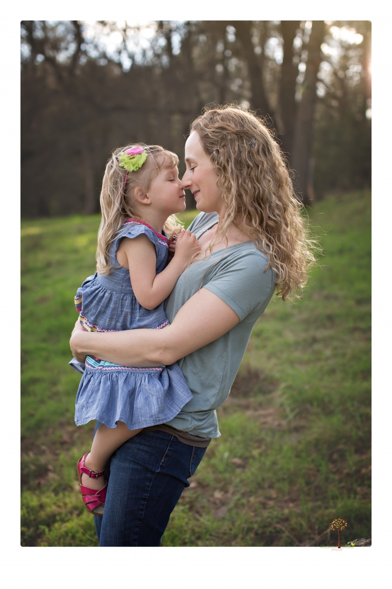 This Indigeny family portrait session, photographed by Christine Dibble Photography of Sonora, included lots of play and group hugs and running around for natural and relaxed family portraits.