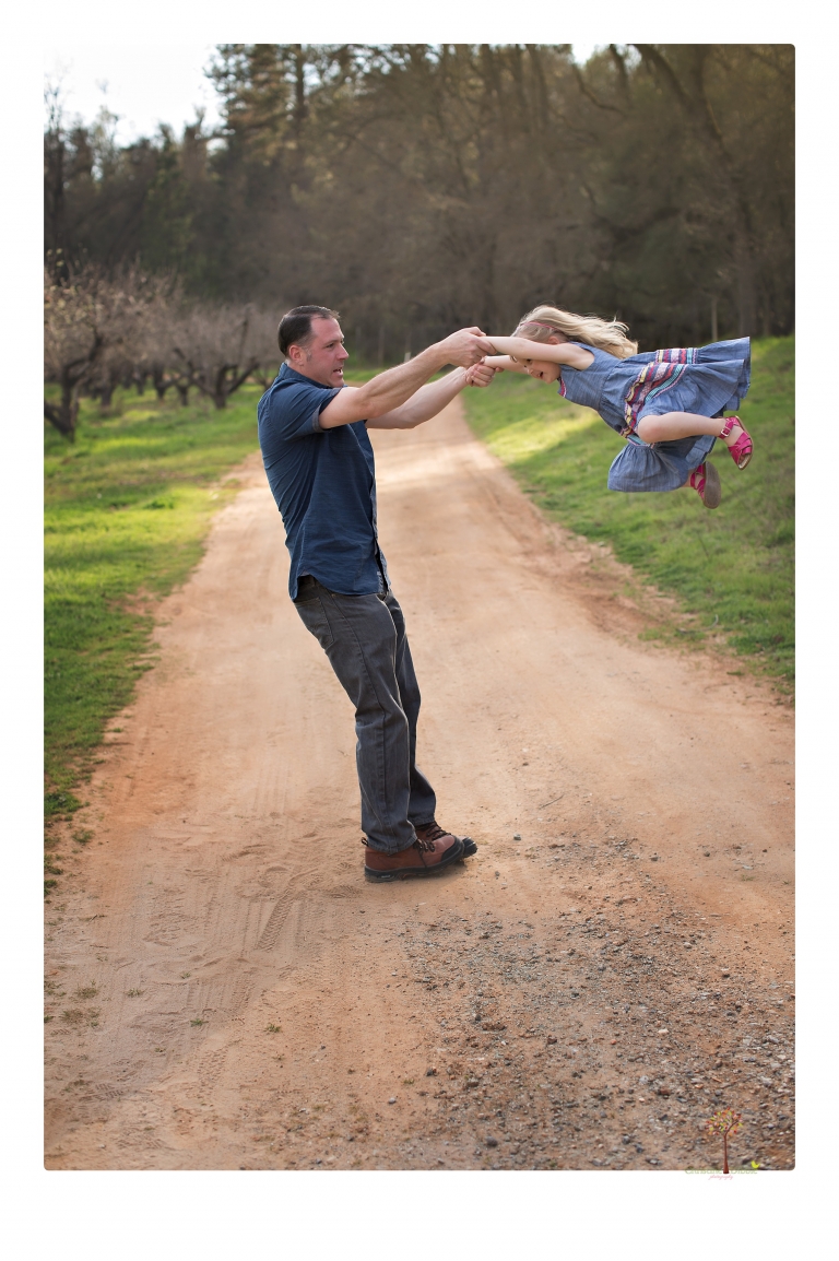 This Indigeny family portrait session, photographed by Christine Dibble Photography of Sonora, included lots of play and group hugs and running around for natural and relaxed family portraits.