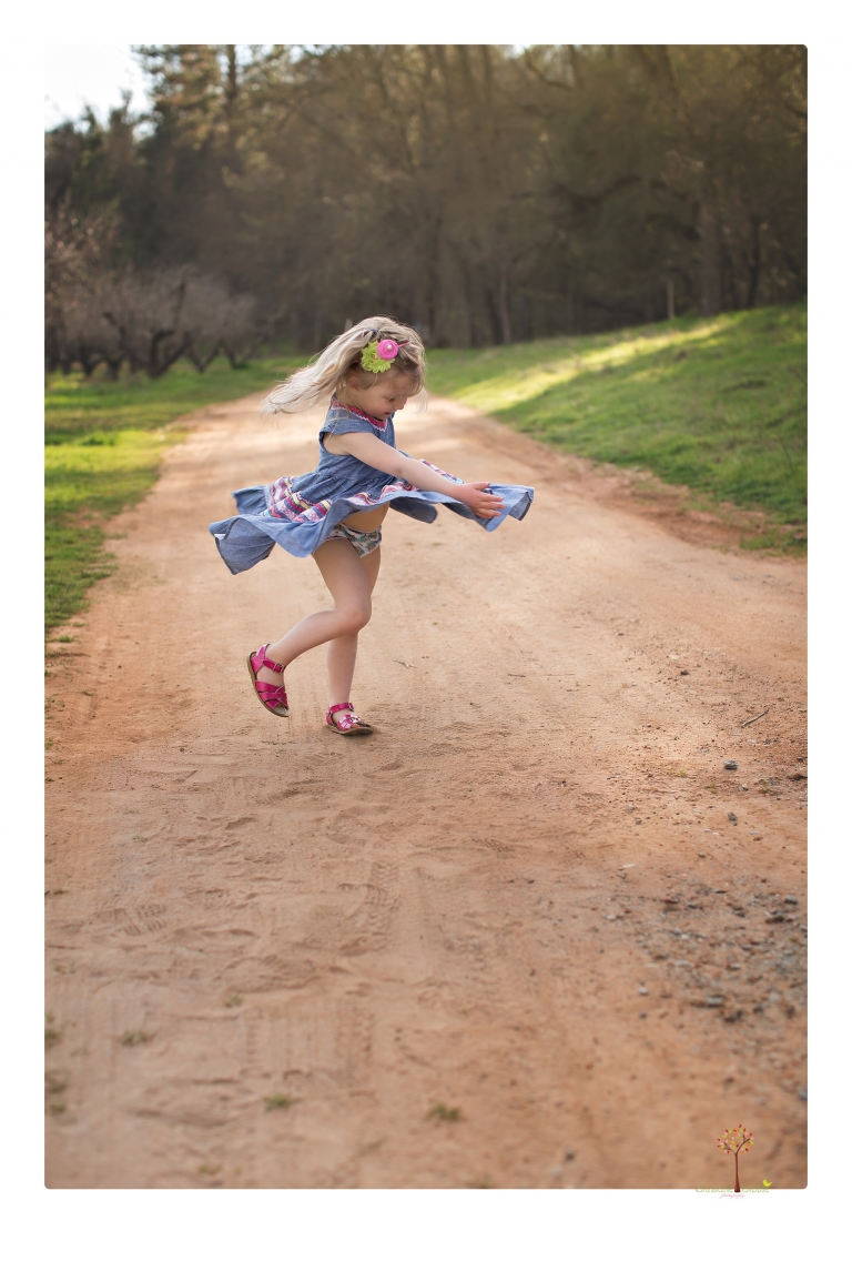 This Indigeny family portrait session, photographed by Christine Dibble Photography of Sonora, included lots of play and group hugs and running around for natural and relaxed family portraits.