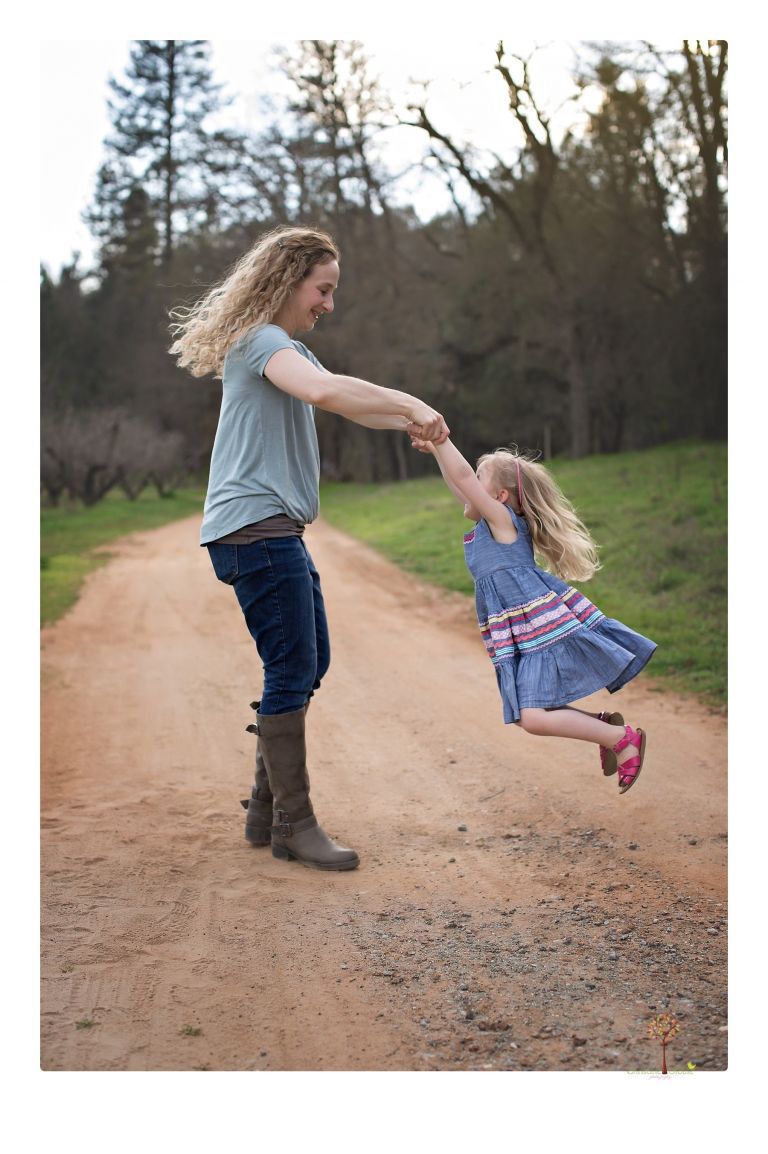 This Indigeny family portrait session, photographed by Christine Dibble Photography of Sonora, included lots of play and group hugs and running around for natural and relaxed family portraits.