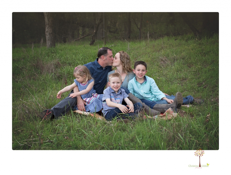 This Indigeny family portrait session, photographed by Christine Dibble Photography of Sonora, included lots of play and group hugs and running around for natural and relaxed family portraits.