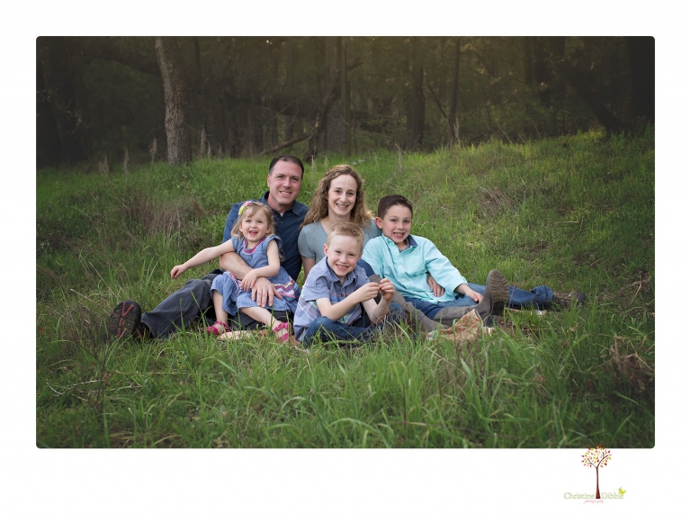 This Indigeny family portrait session, photographed by Christine Dibble Photography of Sonora, included lots of play and group hugs and running around for natural and relaxed family portraits.