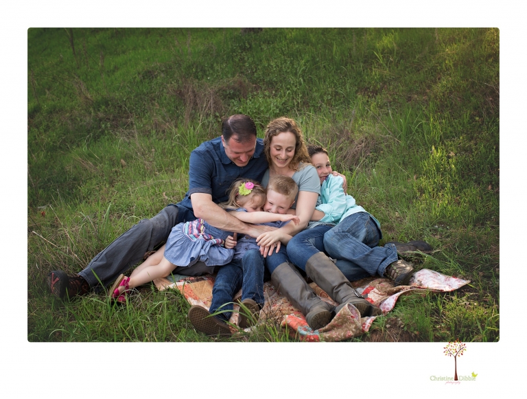 This Indigeny family portrait session, photographed by Christine Dibble Photography of Sonora, included lots of play and group hugs and running around for natural and relaxed family portraits.