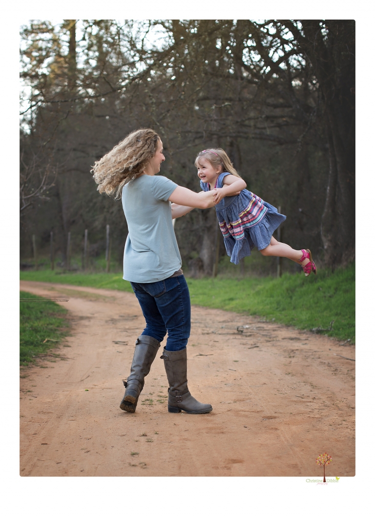 This Indigeny family portrait session, photographed by Christine Dibble Photography of Sonora, included lots of play and group hugs and running around for natural and relaxed family portraits.