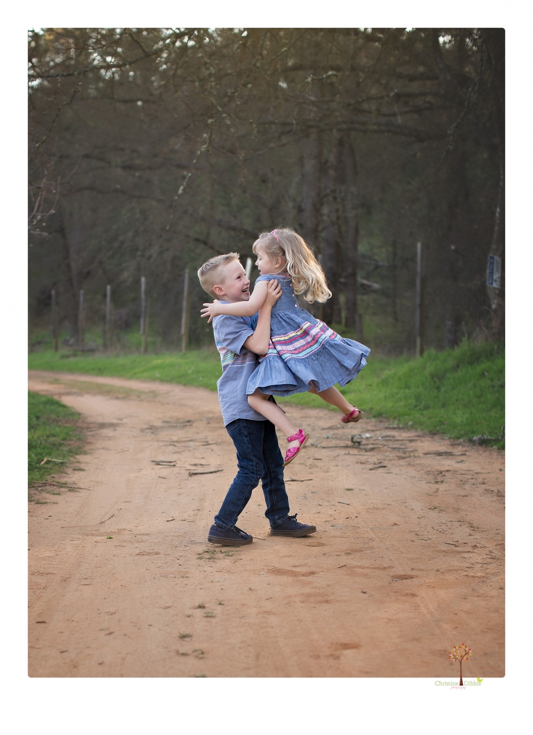 This Indigeny family portrait session, photographed by Christine Dibble Photography of Sonora, included lots of play and group hugs and running around for natural and relaxed family portraits.