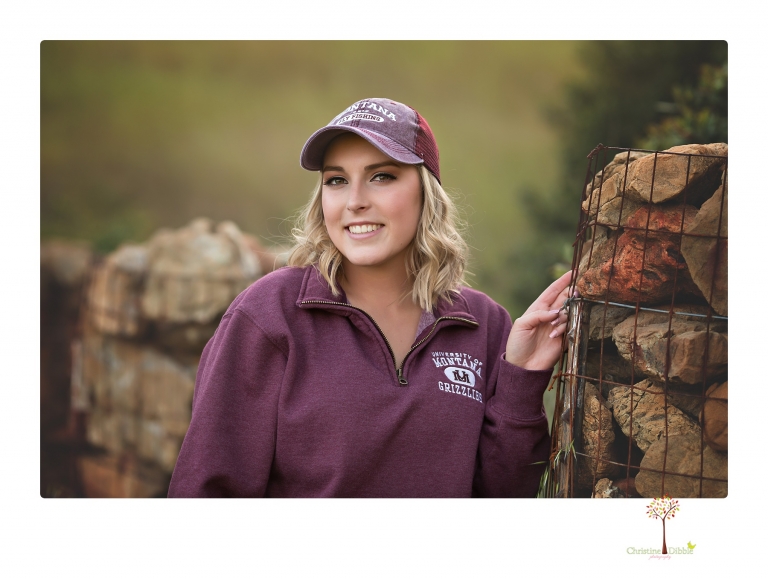 Sonora High senior portrait photographer Christine Dibble Photography takes senior portraits of a girl on her family's Chinese Camp ranch among wildflowers in a creek and with an American flag.