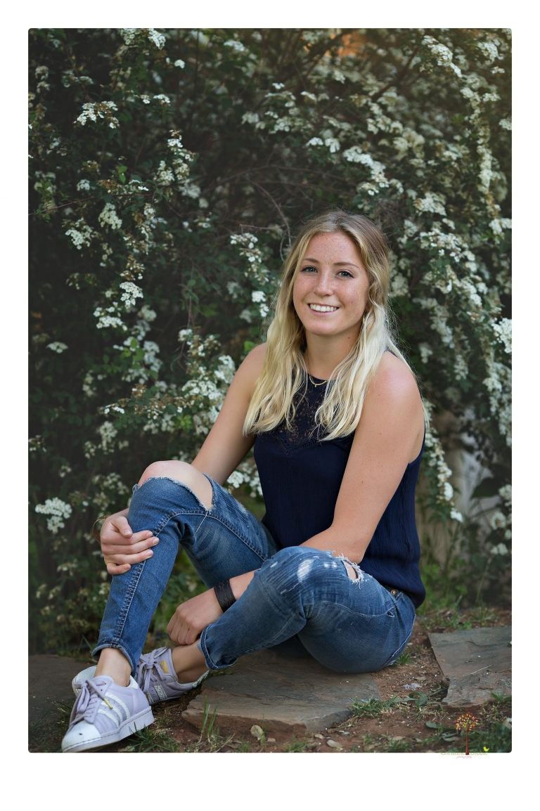 Sonora senior portrait photographer Christine Dibble Photography photographs a Sonora water polo graduate in her yard.