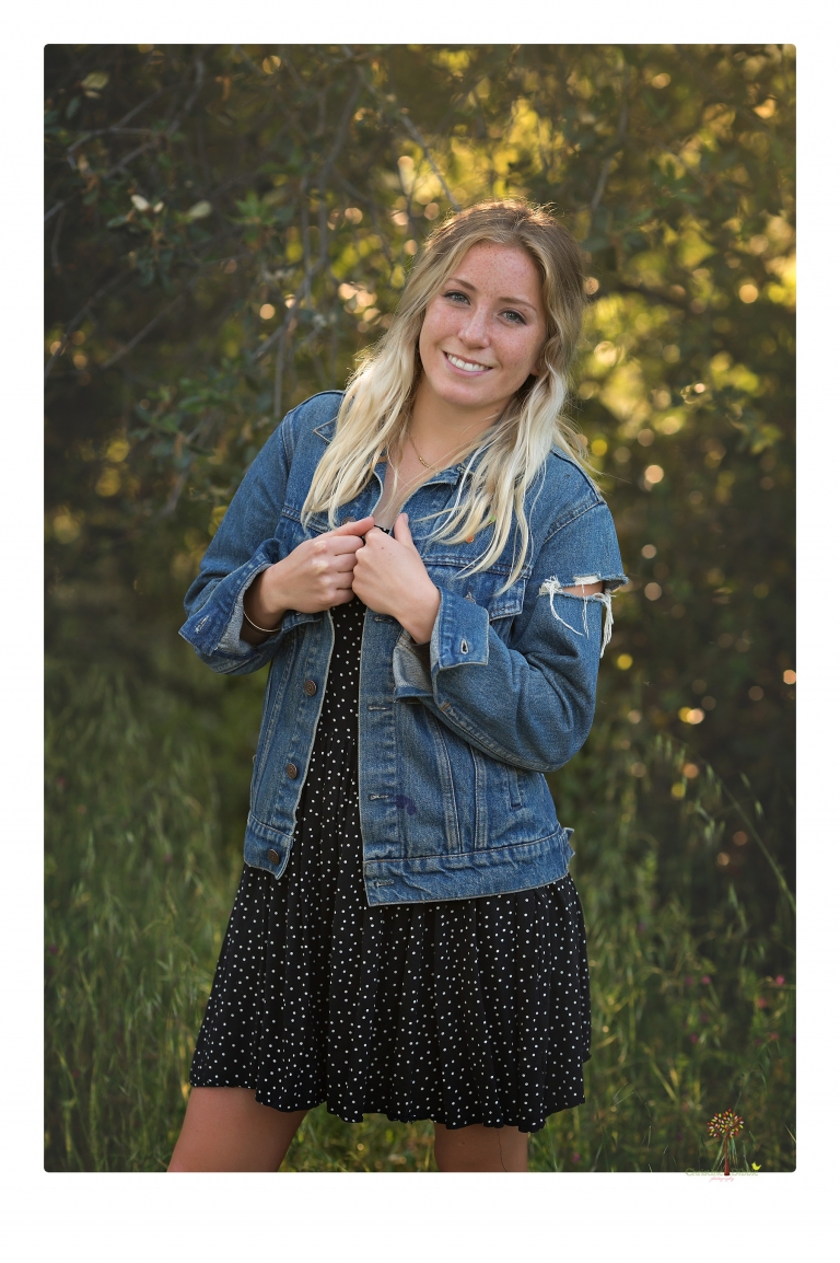Sonora senior portrait photographer Christine Dibble Photography photographs a Sonora water polo graduate in her yard.
