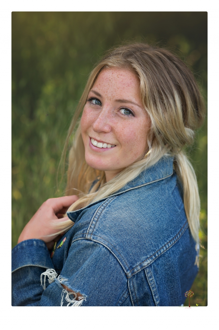 Sonora senior portrait photographer Christine Dibble Photography photographs a Sonora water polo graduate in her yard.