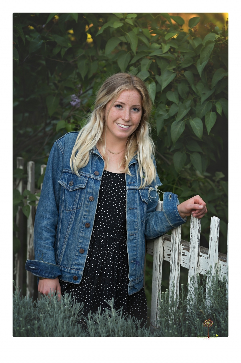 Sonora senior portrait photographer Christine Dibble Photography photographs a Sonora water polo graduate in her yard.
