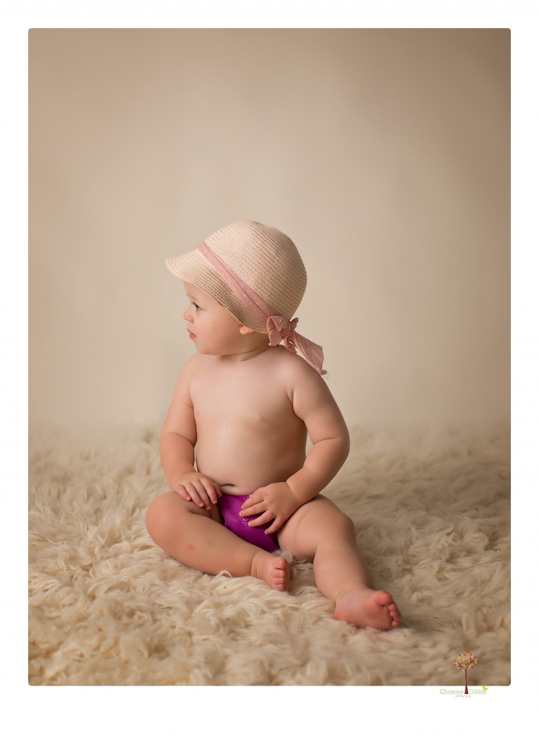 Sonora Baby Photographer Christine Dibble Photography photographs a first birthday session of a girl wearing a flower girl dress made from her mother's wedding dress.