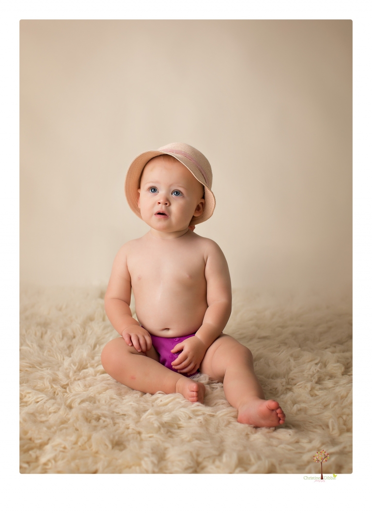 Sonora Baby Photographer Christine Dibble Photography photographs a first birthday session of a girl wearing a flower girl dress made from her mother's wedding dress.