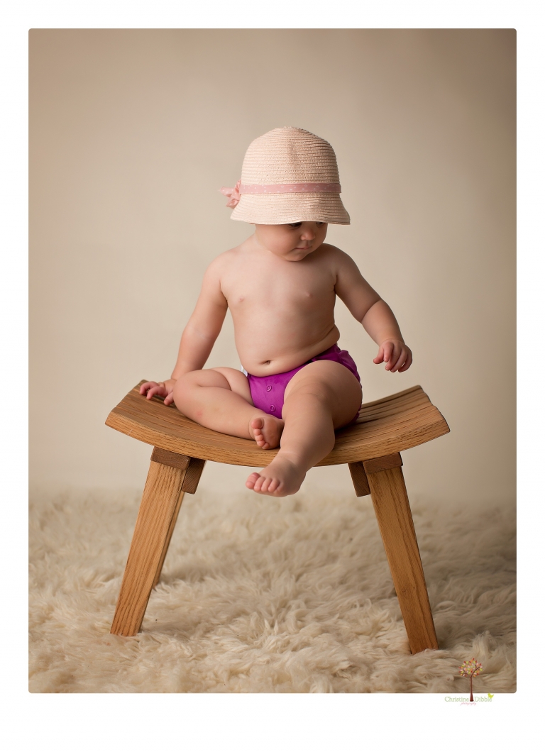 Sonora Baby Photographer Christine Dibble Photography photographs a first birthday session of a girl wearing a flower girl dress made from her mother's wedding dress.