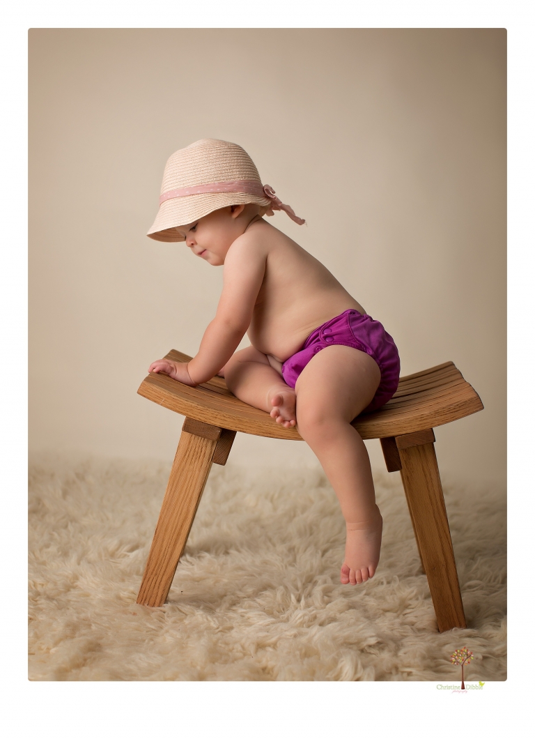 Sonora Baby Photographer Christine Dibble Photography photographs a first birthday session of a girl wearing a flower girl dress made from her mother's wedding dress.