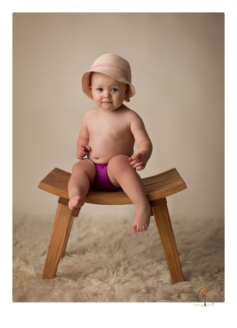 Sonora Baby Photographer Christine Dibble Photography photographs a first birthday session of a girl wearing a flower girl dress made from her mother's wedding dress.