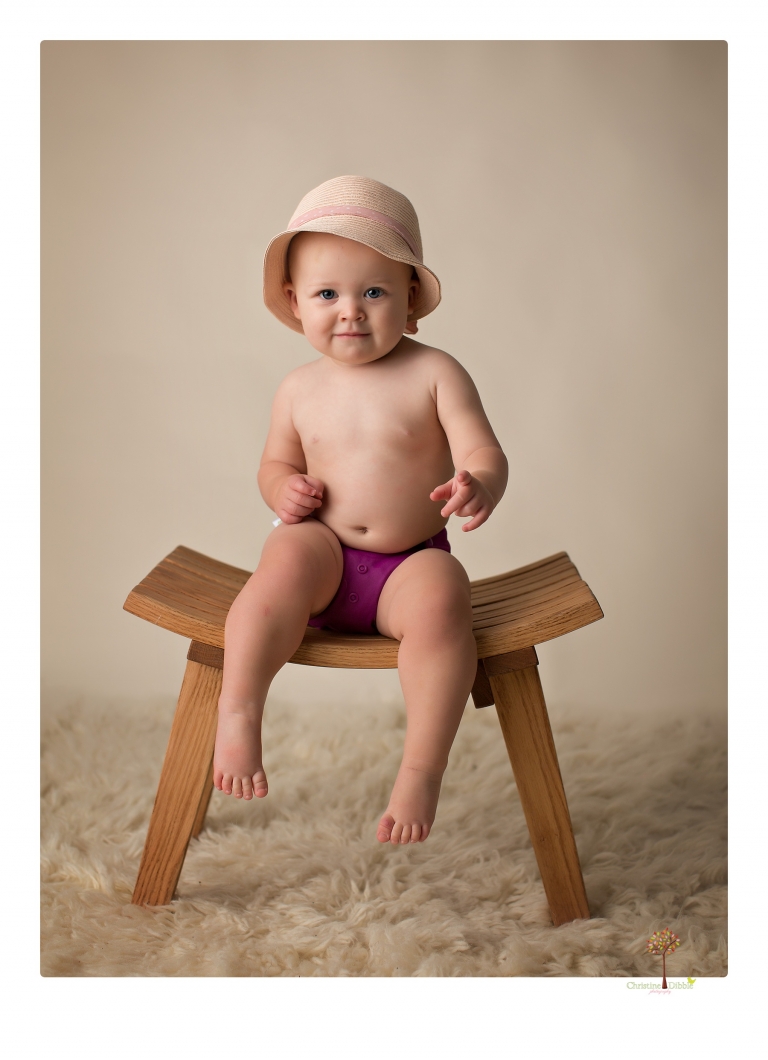 Sonora Baby Photographer Christine Dibble Photography photographs a first birthday session of a girl wearing a flower girl dress made from her mother's wedding dress.